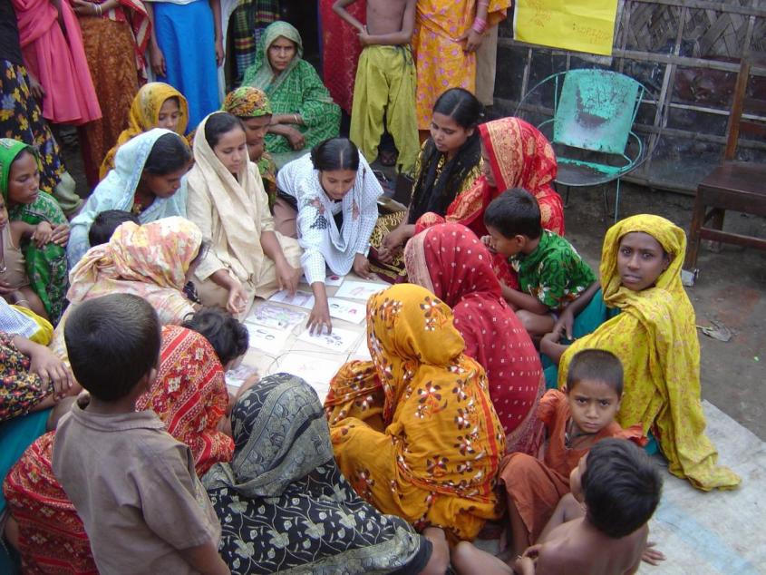 women attending community meeting