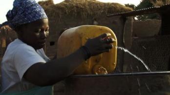 Burkinabe woman pouring water
