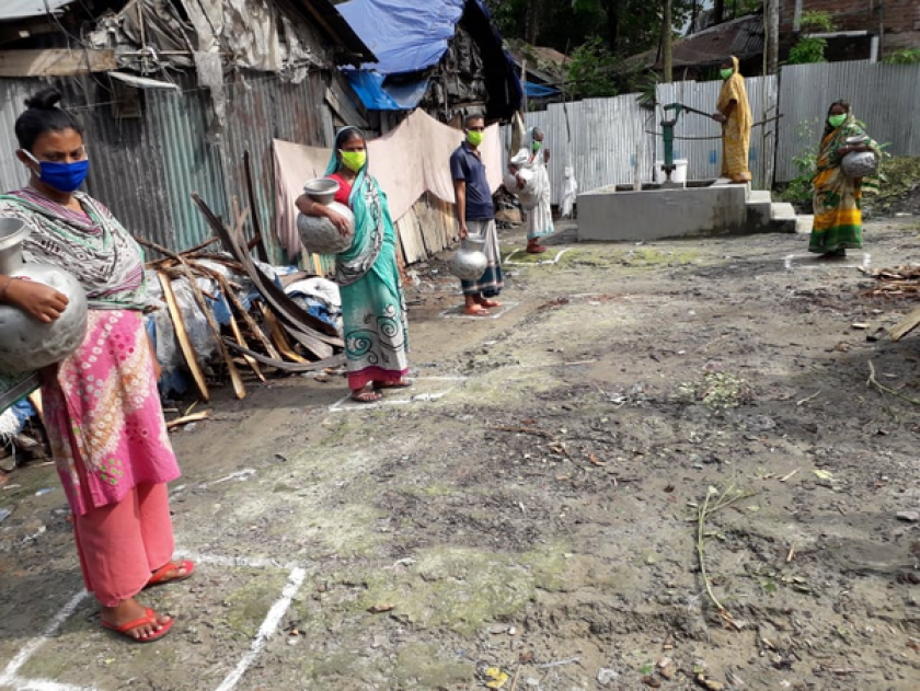 COVID-19 - Social distancing at a handpump in Bangladesh