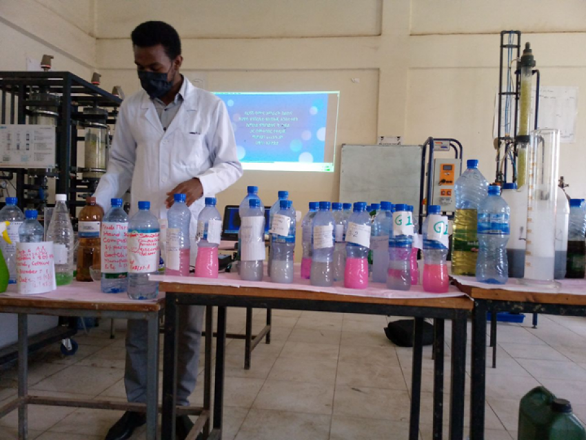 A trainer demonstrating the process of producing liquid soap in a laboratory setting - Photo by: Tsehay 