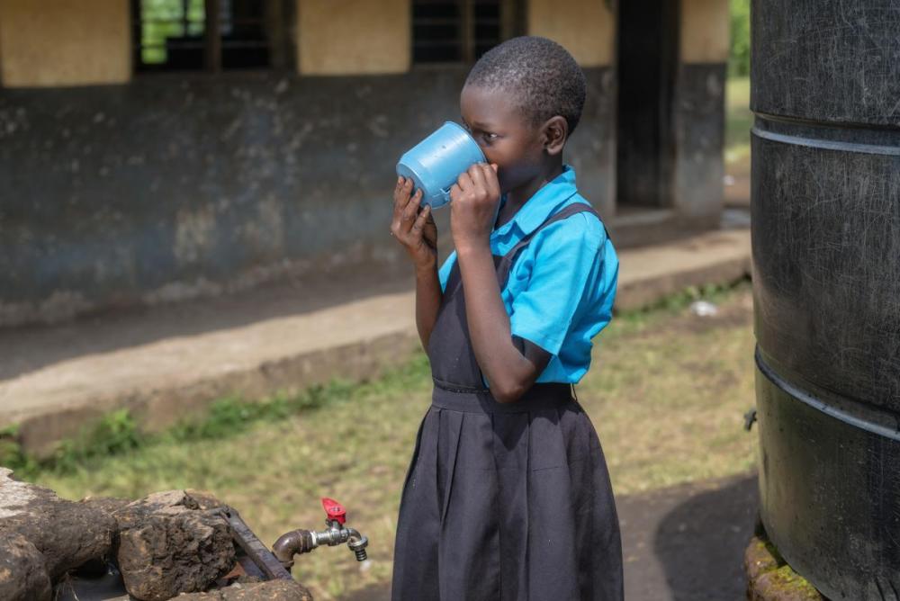 Girl drinking water in Fort Portal, Uganda (photo credits: Agenda For Change)