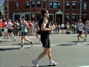 Man running backwards in a marathon