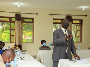 Mr Peter Sunday Rusoke, Minister of Culture, Tooro Kingdom, Kabarole speaks at meeting