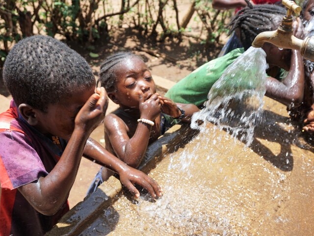 Happy children in Ethiopia enjoying water