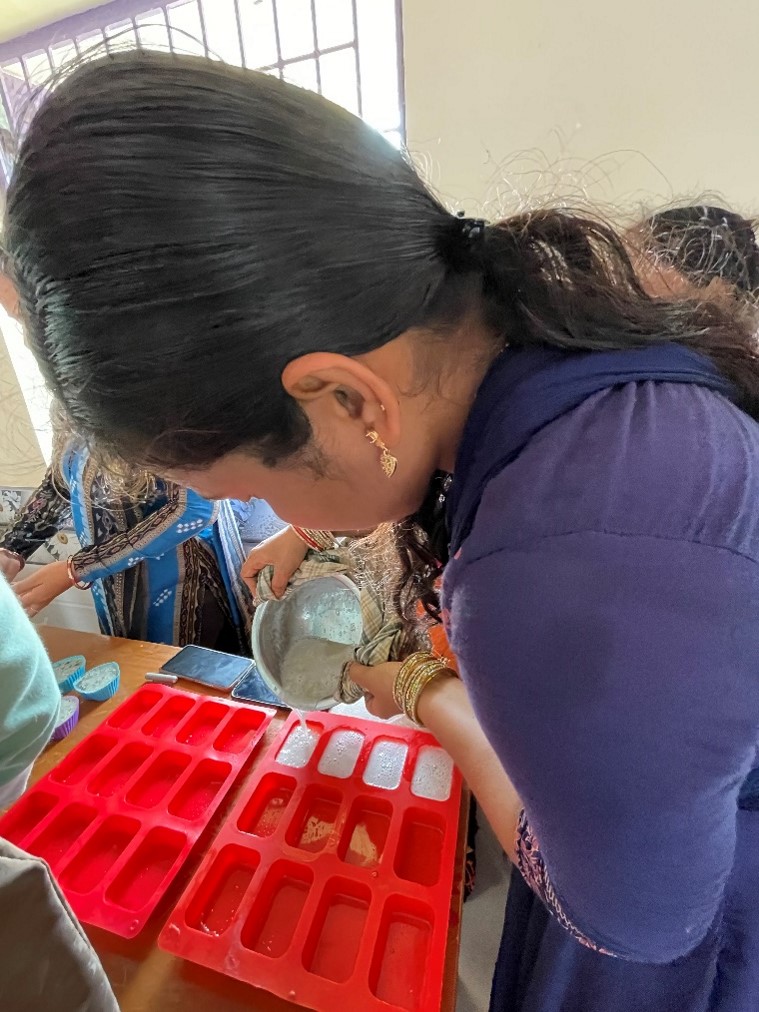 Pragati project Odisha, India - training session - woman making soap